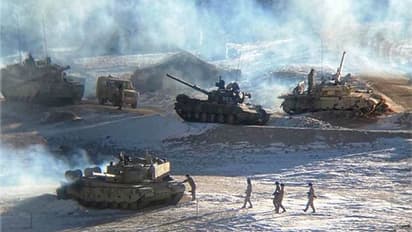 PHOTOS: China packs its bags, takes tanks and tents off Fingers