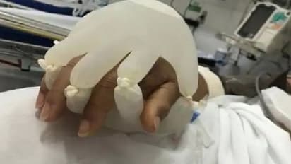 ഒറ്റപ്പെട്ട കൊവിഡ് രോഗികള്ക്ക് കരുതലിന്റെ സ്പര്ശം; ശ്രദ്ധേയമായി ചിത്രം