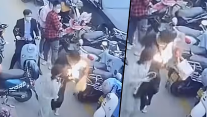 Mobile Phone bursts into flames inside man's bag, Watch the viral video