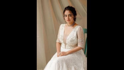 திருமண உடையில்... மணமகளாகவே மாறிய நித்யா மேனன் ..! கியூட்டாக முத்தம் பரிமாறிக்கொண்ட புகைப்படங்கள்..!