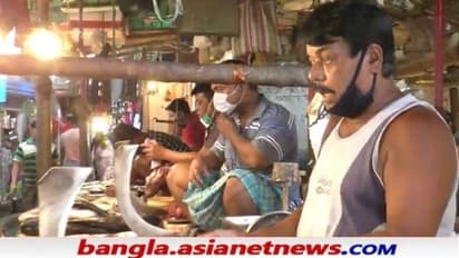 মাছ বিকোতে খসল মাস্ক,   বাজার বন্ধে মাইকিংয়েও হল না কাজ, শেষে লাঠি উঁচিয়ে ধমক পুলিশের