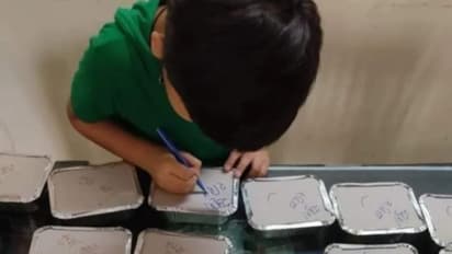 'സന്തോഷമായിരിക്കൂ', കൊവിഡ് രോഗികൾക്കായി അമ്മ തയ്യാറാക്കിയ സൗജന്യഭക്ഷണ പാക്കറ്റിൽ സ്നേഹം നിറച്ച് മകൻ