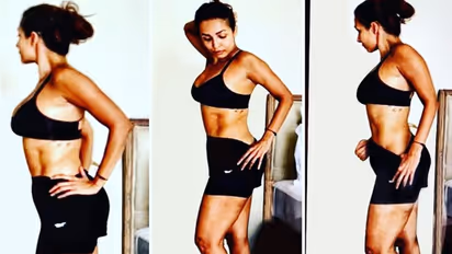 সুস্পষ্ট বক্ষ-বিভাজিকা, স্পোর্টস ব্রা-এর নিচে বেরিয়ে এল স্ট্রেচ মার্কস, নোংরা কটাক্ষ মালাইকাকে