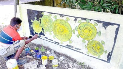 കൊവിഡ് അമ്മയുടെ ജീവനെടുത്തു; പ്രതിരോധ ചുമരെഴുത്തുമായി മകന്