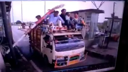 Watch truck filled with people gets hit by a barrier at the toll plaza