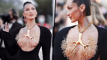 Bella Hadid in 'FRONTLESS' gown; flaunts her golden lung necklace (Pictures Inside)