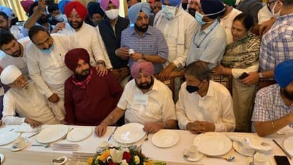 Calling truce, Punjab CM Singh meets Navjot Sidhu, sip tea ahead of coronation of state Congress chief