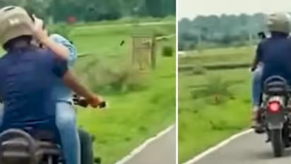 യുവതിയെ മടിയില്‍ മുഖാമുഖം ഇരുത്തി യുവാവിന്റെ  ബുള്ളറ്റ് യാത്ര, വീഡിയോ വൈറലായി