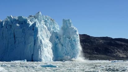 Rainfall recorded at highest point of Greenland's ice sheet for first time, signals climate change