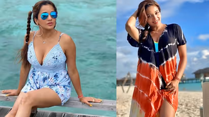 PHOTOS: 2 चोटी, कानों में बड़े-बड़े ईयरिंग्स और नीला चश्मा, समंदर किनारे कातिलाना अंदाज में दिखीं मोनालिसा