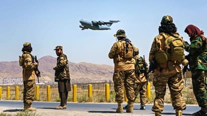 Afghan police returns to work alongside Taliban security at Kabul airport