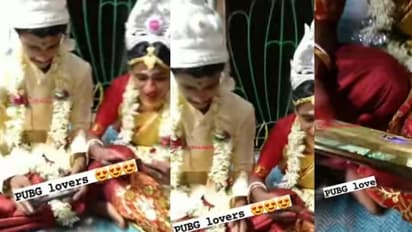 വിവാഹവേദിയിൽ ഫോണിൽ ഫ്രീ ഫയർ ഗെയിം കളിച്ച് വധൂവരന്മാര്; വൈറലായി വീഡിയോ