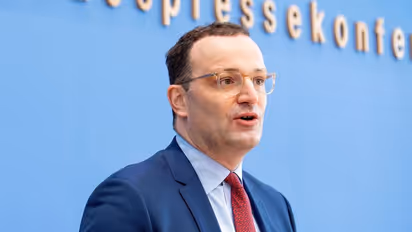 German Health Minister says citizens will be either 'vaccinated, cured or dead' amid rise in COVID cases