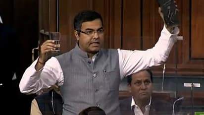 MP Holding Liquor Bottle: সংসদে মদের বোতল হাতে বিজেপি সাংসদ, কিন্তু কেন
