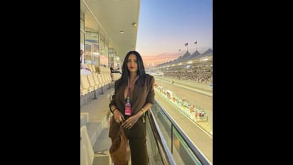 Esha Gupta slays in a shirtless pantsuit at Formula One race