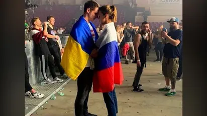 Viral photo of couple draped in Russian-Ukrainian flag is unmissable