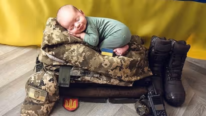 'Goodbye my little boy': Photo of baby sleeping on Ukrainian army uniform breaks the Internet