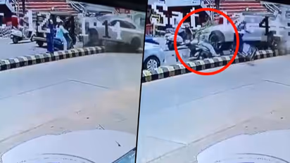 BMW car jumps divider, rams the scooty and injures woman; watch horrifying video