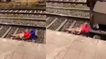ரயில் தண்டவாளத்தில் படுத்துக்கொண்டு பெண் செய்த காரியம்… இணையத்தில் தீயாய் பரவும் வைரல் வீடியோ!!