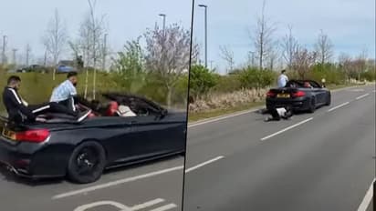Watch: Man falls from BMW as friend attempts to show off at car meet