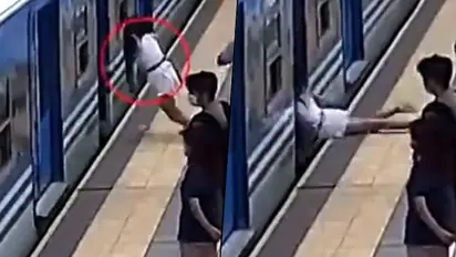 Spine-chilling video shows a woman fainting and falling under a train; watch