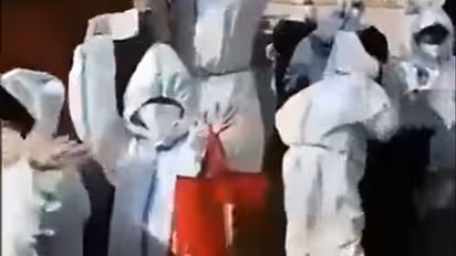 Watch: Unsettling video of children in PPE kits in Shanghai goes viral