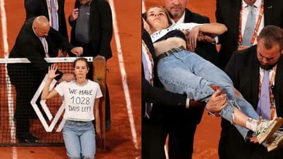 టెన్నిస్ కోర్టులోకి దూసుకొచ్చి.. ఇనుప వైర్లతో కట్టేసుకుని.. ఫ్రెంచ్ ఓపెన్ లో నిరసనకారిణి ఆందోళన