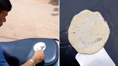 After roti, omelette, scorching heat helps man cook dosa on scooter; Watch