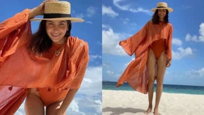 (Pictures) Anushka Sharma enjoys beach vacation in orange monokini with Virat Kohli and Vamika