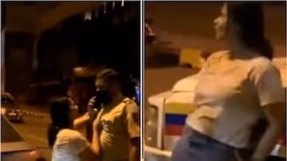  போலீசை எட்டி உதைத்து, சட்டையை பிடித்து உலுக்கி இளம் பெண் அட்ராசிட்டி.. நடு ரோட்டில் போதையில் அசிங்கம்.  