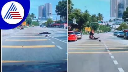 ತಲೆ ಮೇಲೆ ತೆಂಗಿನ ಕಾಯಿ ಬಿದ್ದು, ಬೈಕ್‌ನಿಂದ ಉರುಳಿದ ಮಹಿಳೆ:  ಸಿಸಿಟಿವಿಯಲ್ಲಿ ದೃಶ್ಯ ಸೆರೆ