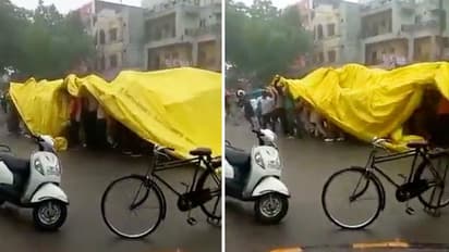 Watch: Wedding procession’s jugaad to battle rain, leaves internet in splits