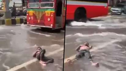 Man lies on waterlogged Mumbai road: Social media compares 'Malad' with Maldives