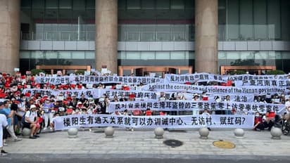 Rattled by protests, Chinese regulators to repay bank depositors