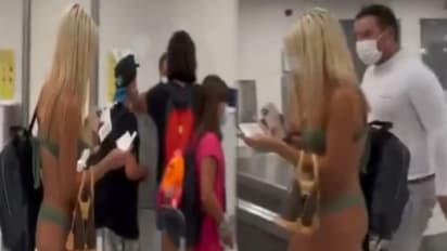 एयरपोर्ट पर मच कई खलबली जब बिकिनी में पहुंची महिला, Video देख लोग बोले-कम से कम मास्क तो पहना