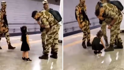 Watch: Little girl touches army personnel's feet; wins hearts on the internet