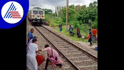 ಲಗೇಜ್ ಹಿಡಿದು ಹಳಿ ದಾಟಿದ ಮಹಿಳೆ, ರೈಲು ಬಂದರೂ ಪವಾಡ ಸದೃಶ ರೀತಿ ಬಚಾವ್!