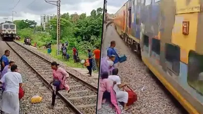 Woman escapes death while crossing railway track: hair-raising video enrages netizens