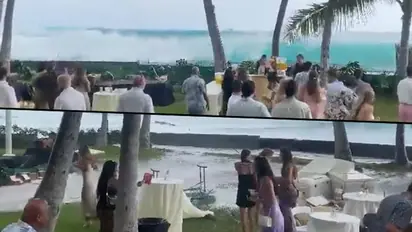 Viral video: Giant waves crash into shore, wedding party disrupted