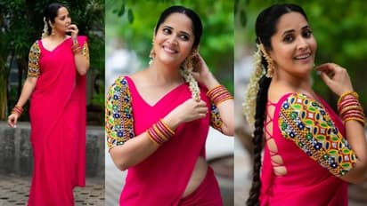 ఎర్ర చీర, కిటికీల జాకెట్ లో అనసూయ హాట్ సర్ప్రైజ్.. కలలో కూడా మరచిపోలేరు, మంటలు రేపిన యాంకర్ 