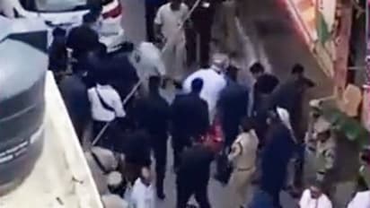 Watch: Telangana BJP chief fetches Amit Shah's shoes; opposition reacts