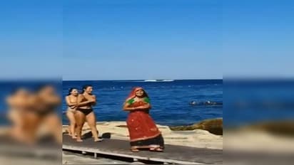 একঝাঁক বিকিনি পরিহিতাদের মাঝে স্বাচ্ছন্দে 'বেমানান' মহিলা, ভিডিও ঘিরে হইচই নেটপাড়ায়