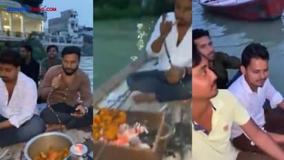 प्रयागराज में उफनती गंगा नदी में नाव पर बैठ हुक्का पीते-चिकन खाते युवक, Video से मचा हड़कंप