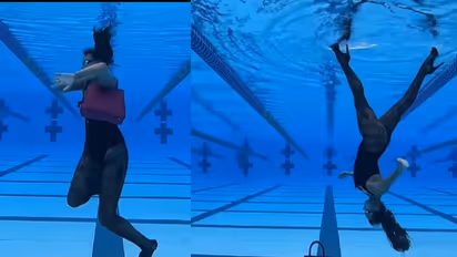 জলের তলায় উল্টো ক্যাটওয়াক, চোখধাঁধানো ভিডিওতে মহিলার কেরামতিতে তোলপাড় নেটদুনিয়া