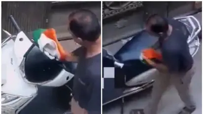 സ്കൂട്ടര് തുടച്ച് മിനുക്കാന് ഉപയോഗിച്ചത് ദേശീയപതാക; വീഡിയോ വൈറലായതോടെ കുടുങ്ങി, അബദ്ധമെന്ന് വിശദീകരണം