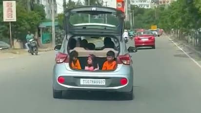 Watch: Video of kids sitting in the open boot of a moving car goes viral; Netizens loads with criticism