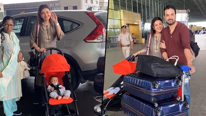 Kajal Aggarwal REVEALS son Neil Kitchlu’s face for the first time; snapped with hubby Gautam at airport