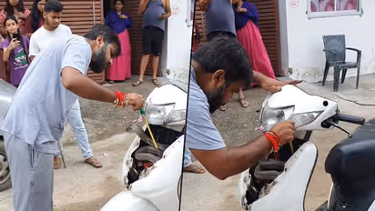 Man rescues cobra stuck inside scooter with bare hands; watch video
