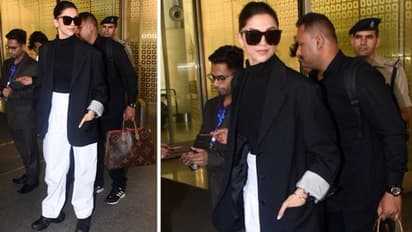 Deepika Padukone's airport look on point as she carries her infectious smile poses for cameras