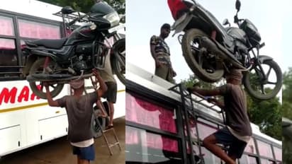 ಇಲ್ಲಿ ನೋಡಿ ರಿಯಲ್ ಬಾಹುಬಲಿ: ತಲೆಯ ಮೇಲೆ ಬೈಕ್ ಏರಿಸಿ ಹೊರಟ ಕೂಲಿ